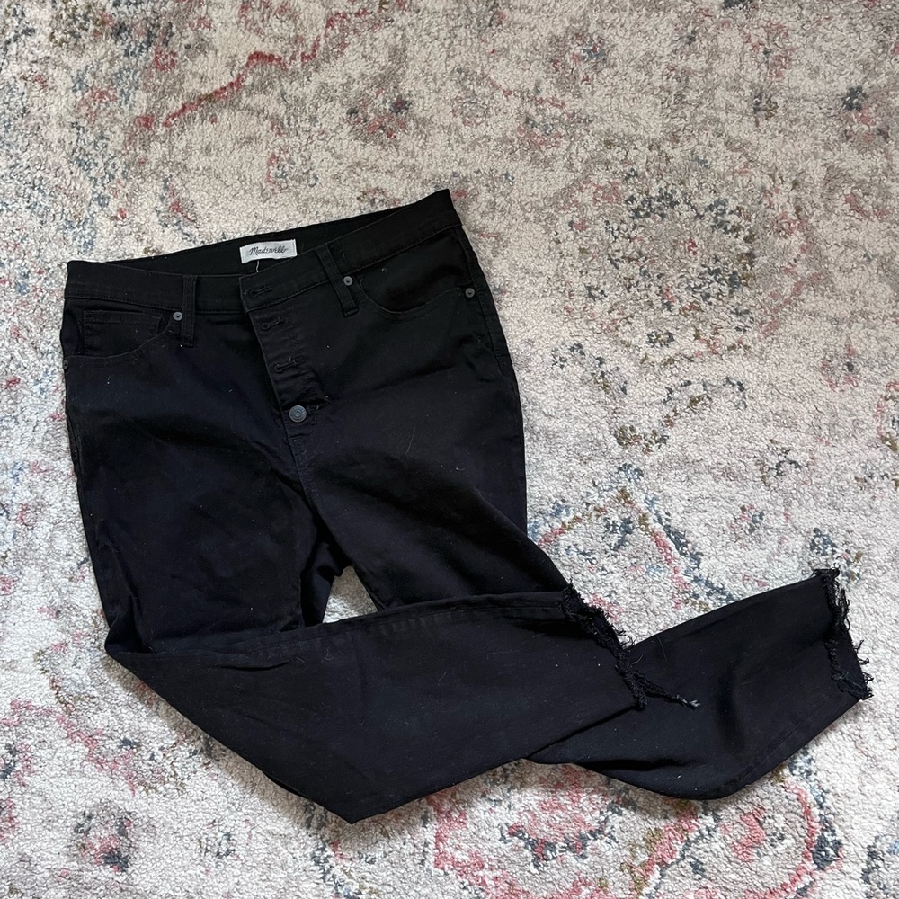 Black Madewell raw hem button fly jeans